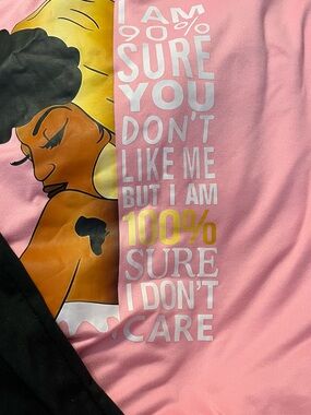 Pink Graphic Tee with Bold Statement and black biker shorts
